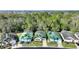 Aerial view of the neighborhood, featuring the colorful homes and their well maintained lawns at 446 Reserve Dr, Davenport, FL 33896