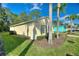 Single Gathering home with mature landscaping and a view of the side yard at 446 Reserve Dr, Davenport, FL 33896