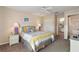 Bedroom with ensuite bathroom and a queen sized bed at 446 Reserve Dr, Davenport, FL 33896