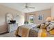 Bedroom featuring a queen size bed, neutral colored walls and a white dresser at 446 Reserve Dr, Davenport, FL 33896