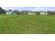 Expansive grassy backyard, perfect for recreation and relaxation, includes a playset at 4774 Rummell Rd, St Cloud, FL 34771