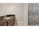 Bathroom featuring a dark granite countertop vanity and a shower with a decorative curtain at 4774 Rummell Rd, St Cloud, FL 34771