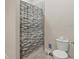 Bathroom featuring a toilet and a shower with a patterned shower curtain at 4774 Rummell Rd, St Cloud, FL 34771