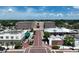 Aerial view of City Hall and surrounding buildings with distinct architecture and a brick-paved road at 4774 Rummell Rd, St Cloud, FL 34771