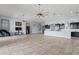 Expansive open-concept great room with tile flooring, ceiling fans, and ample natural light at 4774 Rummell Rd, St Cloud, FL 34771