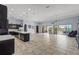 Spacious living area featuring sliding glass doors to the lanai and seamless flow to the kitchen at 4774 Rummell Rd, St Cloud, FL 34771