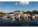 Picturesque marina with boats docked and a clubhouse in the background, perfect for boating enthusiasts at 4774 Rummell Rd, St Cloud, FL 34771