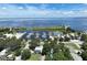 Aerial shot of a marina, featuring boat slips, waterways, and a nearby clubhouse with ample parking at 4774 Rummell Rd, St Cloud, FL 34771