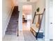 Open entryway showcasing stairs, console table, and view into the living room at 4823 Coral Castle Dr, Kissimmee, FL 34746