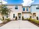 Charming townhome with a well-manicured front yard and spacious driveway at 4823 Coral Castle Dr, Kissimmee, FL 34746