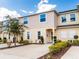 Charming townhome with a well-manicured front yard and spacious driveway at 4823 Coral Castle Dr, Kissimmee, FL 34746