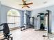 Well-lit on-site gym featuring a wide selection of modern weight training and fitness equipment for all residents at 4823 Coral Castle Dr, Kissimmee, FL 34746