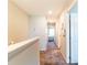 Upstairs hallway featuring neutral paint, carpet flooring, and access to bedrooms at 4823 Coral Castle Dr, Kissimmee, FL 34746
