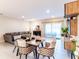 Open-concept living and dining area with tile floors and ample natural light at 4823 Coral Castle Dr, Kissimmee, FL 34746