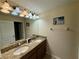 Bright bathroom featuring double sink vanity and ample lighting at 4875 Clock Tower Dr, Kissimmee, FL 34746