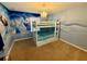 Charming bedroom featuring bunk beds and a Frozen themed mural at 4875 Clock Tower Dr, Kissimmee, FL 34746