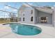 Backyard pool enclosed by a screen, providing a private oasis for swimming and relaxation at 4919 Dunmore Ln, Kissimmee, FL 34746