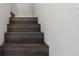 A view of three wooden stairs leading up at 4919 Dunmore Ln, Kissimmee, FL 34746