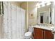 Well-maintained bathroom featuring a shower and vanity with storage at 507 Pamplona Pl, Davenport, FL 33837