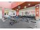 Well-equipped gym featuring weights, benches, and fitness equipment for a comprehensive workout experience at 507 Pamplona Pl, Davenport, FL 33837