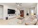 Inviting living room featuring tile flooring, neutral tones, and lots of natural light at 507 Pamplona Pl, Davenport, FL 33837