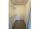 Compact closet with neutral walls, carpeted floor, and wire shelving for storage at 5152 Conroy Rd # 1333, Orlando, FL 32811