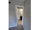 A hallway leads to the bathroom, which features a granite vanity top and neutral tones at 5152 Conroy Rd # 1333, Orlando, FL 32811