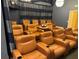 Community theater with multiple leather recliners with a projector on a side table at 5152 Conroy Rd # 1333, Orlando, FL 32811