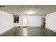 Basement offering a practical space with heater, water heater, and painted brick walls at 525 Garberia Dr, Davenport, FL 33837