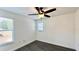 Bedroom with wood-look flooring, ceiling fan, and two windows for plenty of natural light at 525 Garberia Dr, Davenport, FL 33837