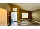 Inviting living room featuring high ceilings, wood-look flooring, and plenty of natural light at 525 Garberia Dr, Davenport, FL 33837