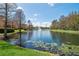 Scenic pond view with fountain and lush greenery in a tranquil community setting at 5463 Vineland Rd # 5107, Orlando, FL 32811