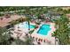 Community pools and lounge chairs offer a relaxing outdoor oasis for residents of this property at 5463 Vineland Rd # 5107, Orlando, FL 32811