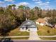 Charming single-Gathering home with a well-manicured front yard and a gray roof at 563 Eagle Pointe S, Kissimmee, FL 34746