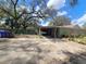 Charming home with covered carport parking and lush landscaping at 610 Buckley Dr, Kissimmee, FL 34741