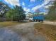 View of the driveway with a large blue dump truck in the back at 610 Buckley Dr, Kissimmee, FL 34741