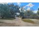 Driveway entrance to a property featuring a truck and a fenced perimeter, enhancing privacy and security at 610 Buckley Dr, Kissimmee, FL 34741