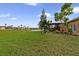 The expansive backyard offers lush green grass and beautiful water views at 651 Glendora Rd, Kissimmee, FL 34759