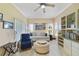 Relaxing living room featuring neutral walls, shutters and custom shelving and storage at 651 Glendora Rd, Kissimmee, FL 34759