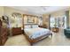 Bright main bedroom featuring a four-poster bed, neutral walls and recessed ceiling lights at 651 Glendora Rd, Kissimmee, FL 34759