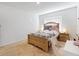 Cozy bedroom featuring a comfortable bed, two nightstands, and neutral colored carpet at 758 Lafayette Ln, Haines City, FL 33844