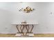 Elegant living room featuring decor, a modern marble table with artistic metal base, and wood floors at 758 Lafayette Ln, Haines City, FL 33844