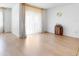 Bright living room with light wood flooring, a sliding glass door, and stylish wine storage at 758 Lafayette Ln, Haines City, FL 33844