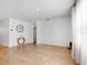 Bright living room with wood flooring, neutral walls, an arched doorway, and modern decor at 758 Lafayette Ln, Haines City, FL 33844