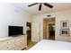 Well-lit main bedroom features a ceiling fan and access to the bathroom at 7660 Whisper Way # 104, Reunion, FL 34747