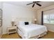 Main bedroom with ceiling fan, neutral walls, and natural light at 7660 Whisper Way # 104, Reunion, FL 34747