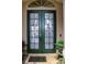 Charming double door entry features decorative glass and a tile threshold at 7670 Milano Dr, Orlando, FL 32835