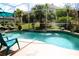 Screened pool and lanai area with lush landscaping create a private outdoor space at 7670 Milano Dr, Orlando, FL 32835