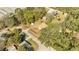 Aerial view of the property showcasing the home, yard, and surrounding neighborhood at 7904 Empire Ave, Orlando, FL 32810