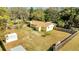 Aerial view of the home with a large, fenced backyard and mature trees at 7904 Empire Ave, Orlando, FL 32810